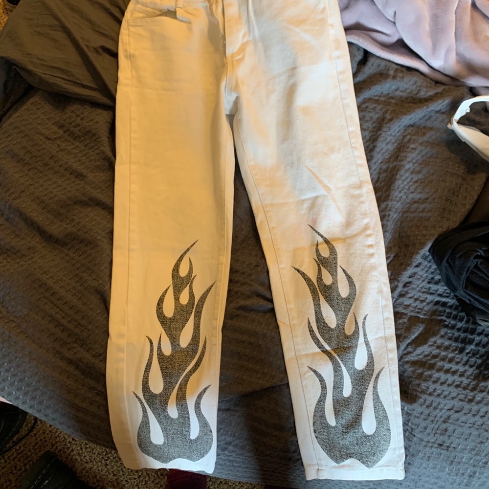 Adika white jeans with black flame at bottom